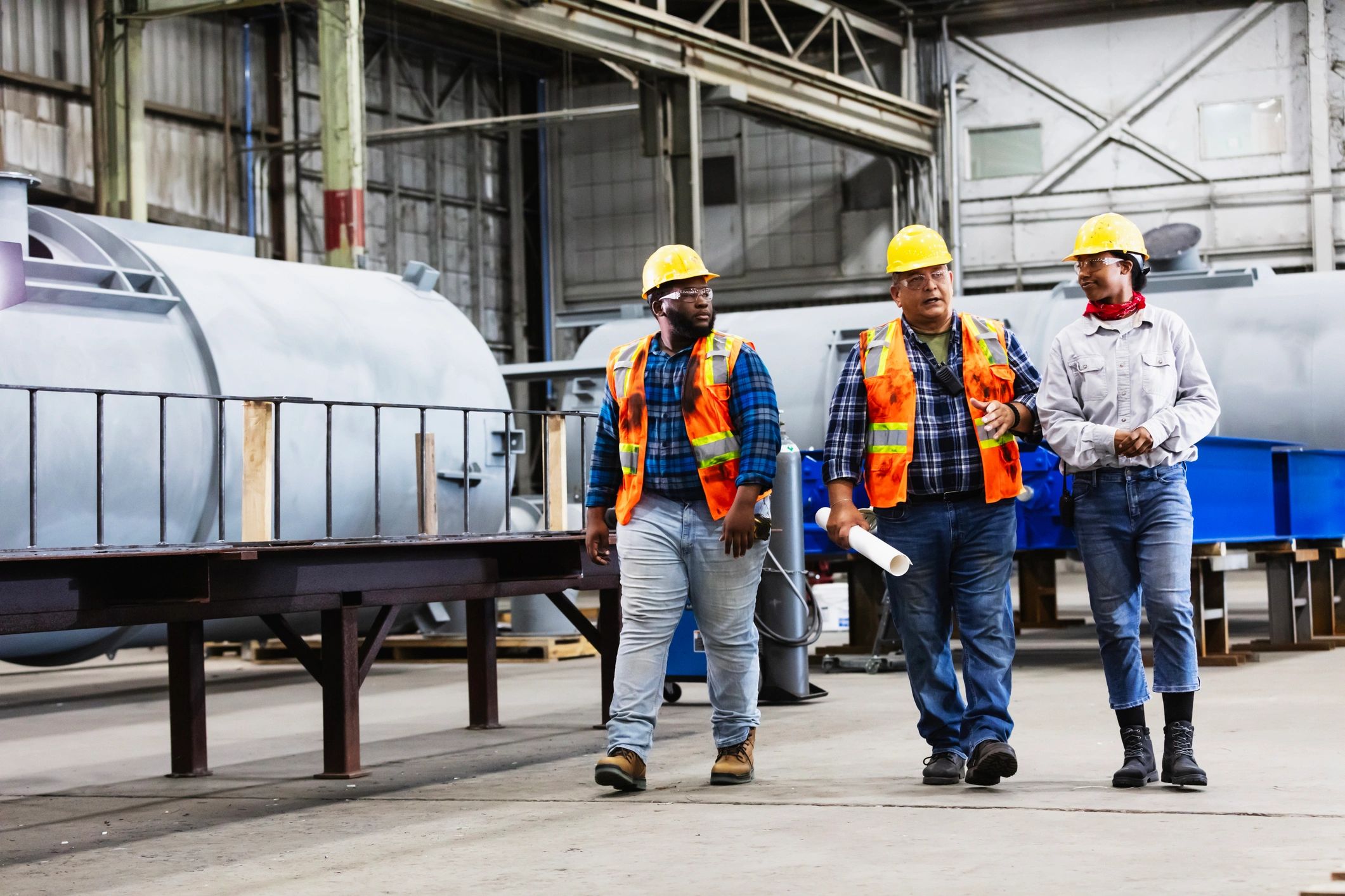 Engineering team discussion on the factory floor